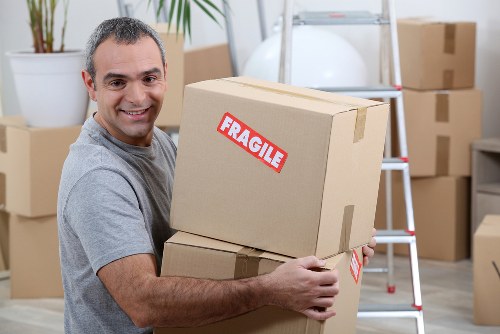 Student removal service in Soho with boxes and furniture ready for loading