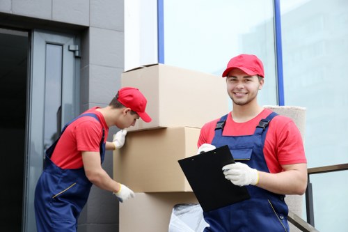 Soho moving team handling boxes and furniture with care