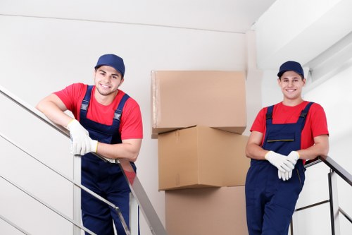 Careful unpacking of boxes in a central London apartment