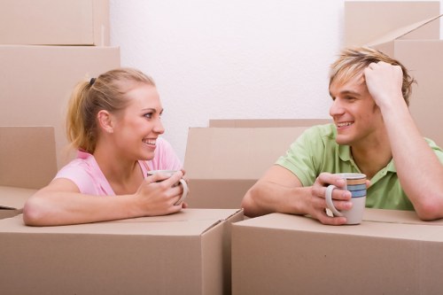 Moving boxes and furniture during a van hire job