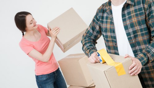 House removals planning in Soho with moving boxes and central London street setting
