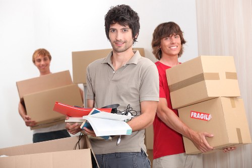 Professional movers handling a Soho property relocation with careful access management