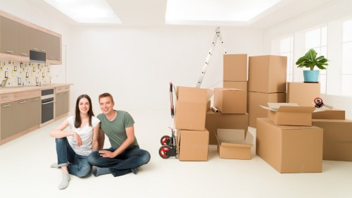 Organised moving boxes and household items inside a central London flat