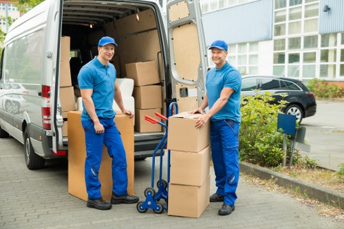 Expert movers handling fragile items during packing services in Soho